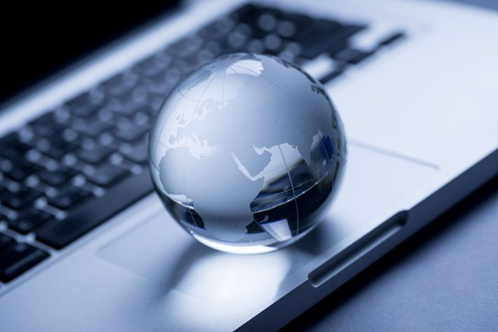 Clear globe on top of keyboard, to represent international mail